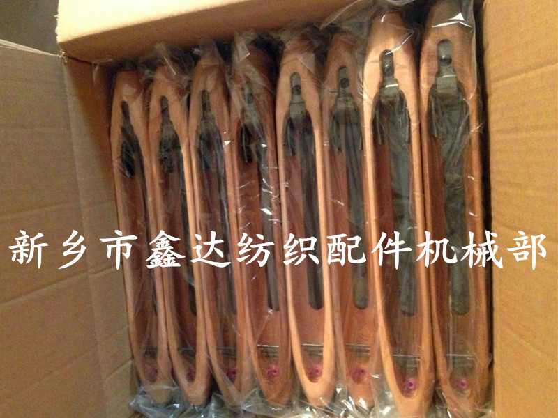 Automatic replacement of wooden shuttles for textile equipment Automatic shuttle replacement modification
